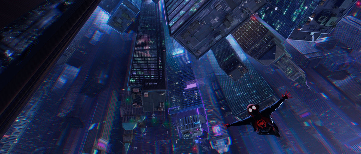 Miles Morales falls above a neon-lit city in Spider-Man: Into the Spider-Verse